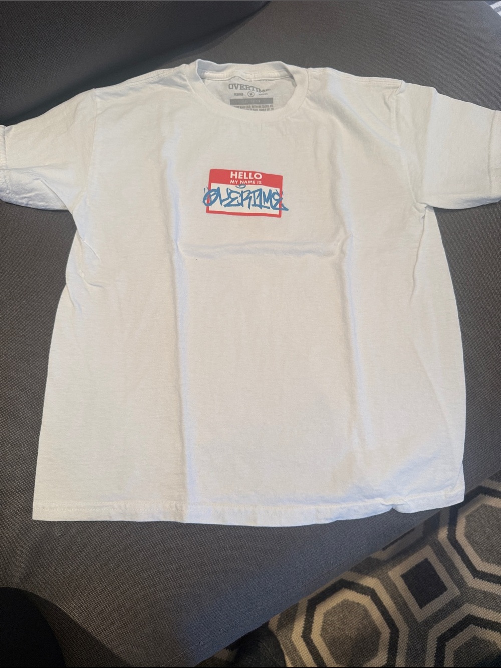 Kids White Graphic Tee with Red Name Badge and Blue Script